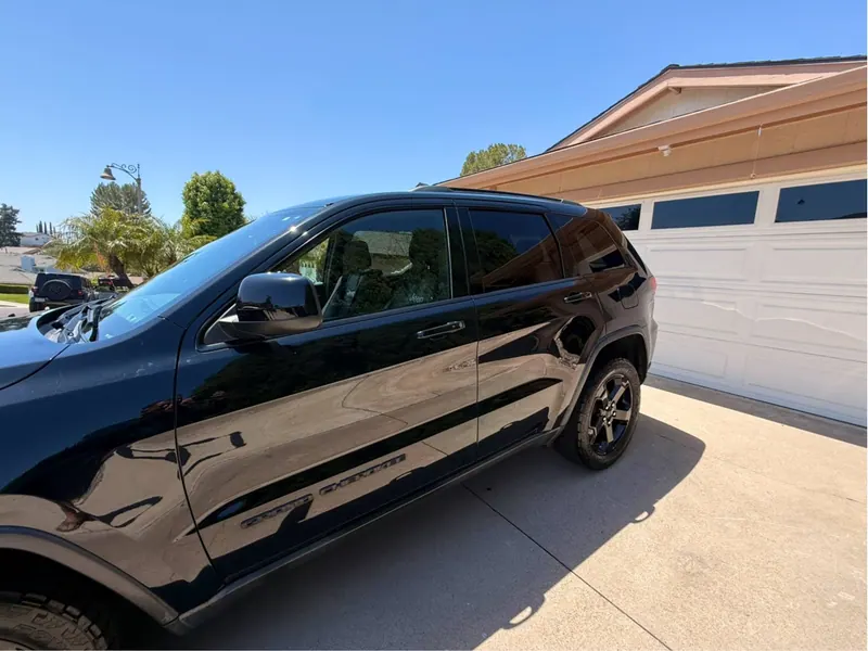 Reflections in a black Jeep after detailing, shared in Dan G.’s Google review